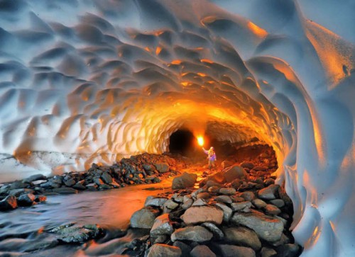 An illuminated snow tunnel in Russia