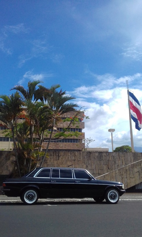 COSTA-RICA-BUILDING-WITH-A-FLAG-AND-LIMOUSINE-MERCEDES-300D.jpg